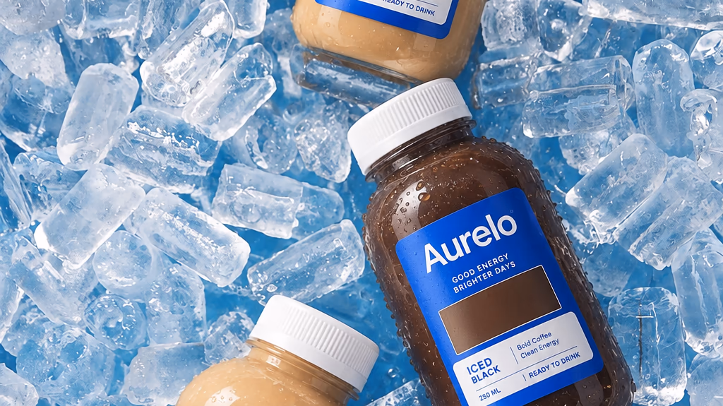 Bottles of Aurelo iced coffee lying on a bed of ice